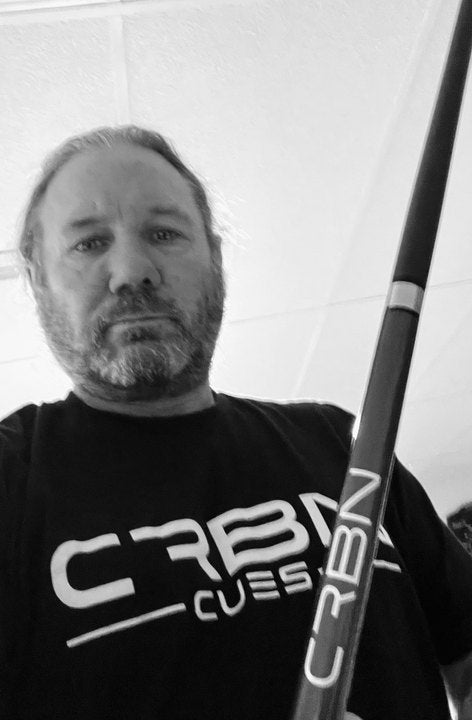 CRBN Cues customer in a CRBN Cues shirt with his CRBN cue