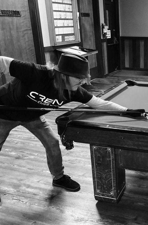 CRBN Cues customer shooting with his CRBN cue on a pool table